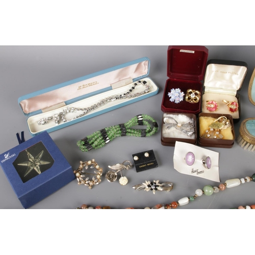 52 - A mixed collection of vintage costume jewellery, quartz watches and pen knives, including necklaces,... 