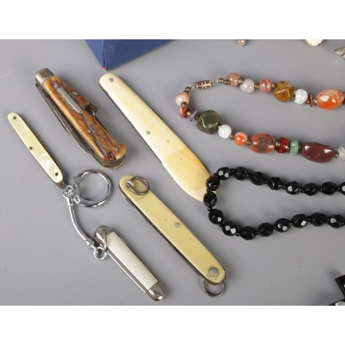 52 - A mixed collection of vintage costume jewellery, quartz watches and pen knives, including necklaces,... 