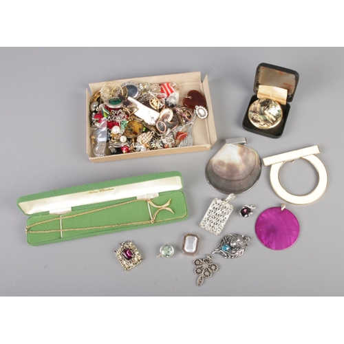 61 - A very large collection of assorted costume jewellery pendants and brooches to include Crown Staffor... 