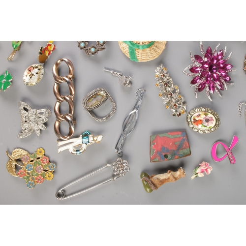 63 - A large collection of costume jewellery brooches, tie slides and scarf rings to include Stratton, fl... 