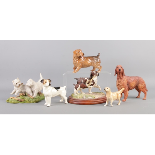 68 - A collection of ceramic and composite dog figures, including examples by Beswick, Border Fine Arts a... 