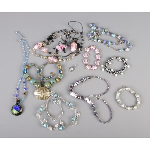 73 - A collection of assorted glass jewellery to include Murano glass bracelet, necklaces and pendants.