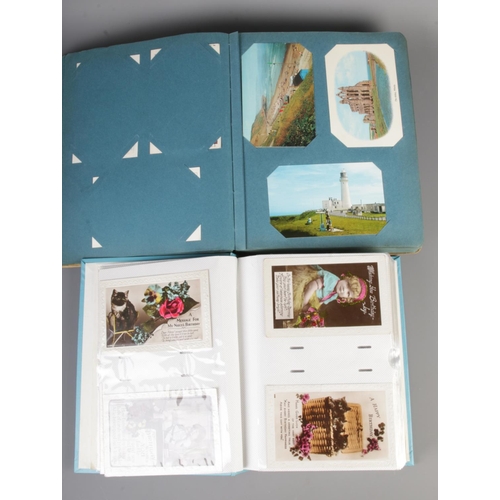 74 - Two albums containing over 400 20th century postcards to include 1920's greetings cards and later 20... 