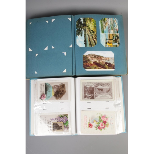 74 - Two albums containing over 400 20th century postcards to include 1920's greetings cards and later 20... 