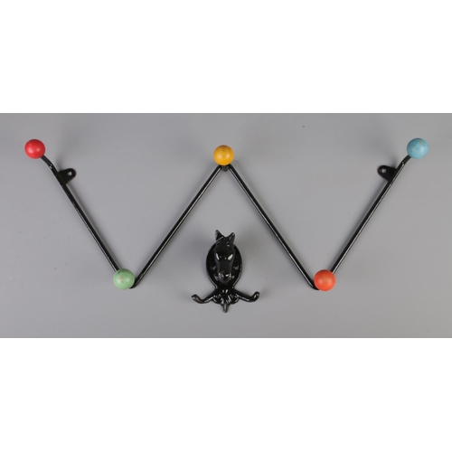 76 - A 20th Century retro sputnik/atomic coat hook rack with a singular coat hook shaped as a horse.