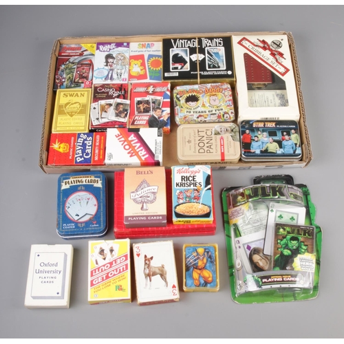 78 - A tray of playing cards and other card games including tinned Dads Army, Star Trek, Beano Dandy, Hul... 