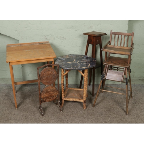 498 - A metamorphic child's highchair with oak plant stand, two tier cake stand, folding desk and a bamboo... 