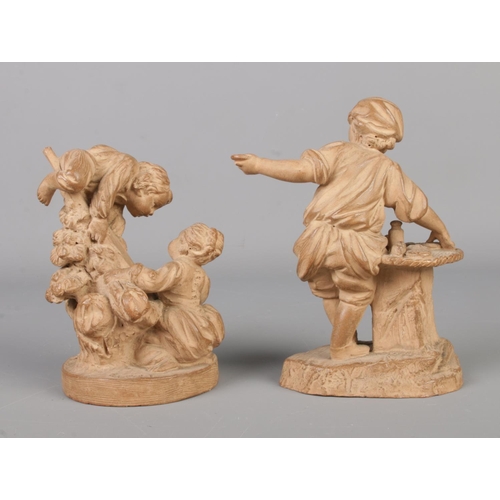 11 - Two late 19th century French small terracotta sculptures. One of a young boy posing as a street trad... 