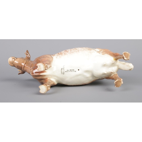 13 - A Beswick figure of a shorthorn cow. Stamped to base Ch. Eaton Wild Eyes 91st. Model Number 1510. He... 