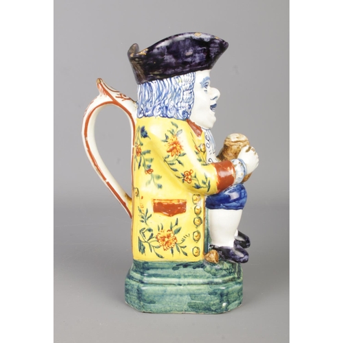 14 - A 19th century polychrome delft Toby jug. Pseudo mark to base for Adrianus Pieter Koeks. Height 20cm... 