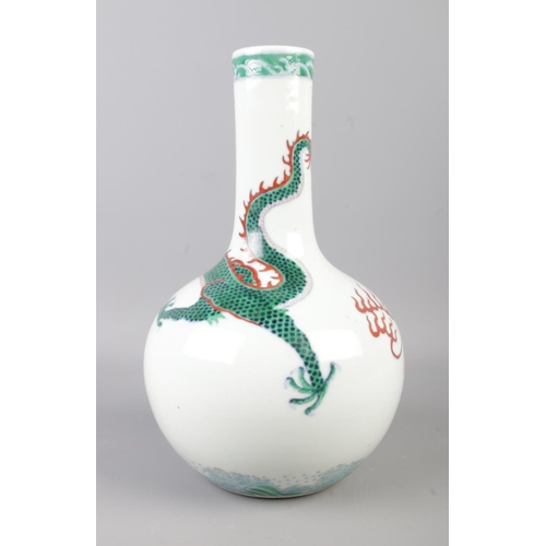 2 - A Chinese bottle vase decorated with a dragon in the famille verte design. Bearing six character mar... 