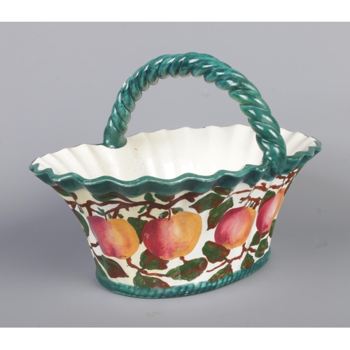 20 - A Robert Heron & Sons Wemyss Ware basket. Hand painted with apples. Height 21cm, Width 30cm.