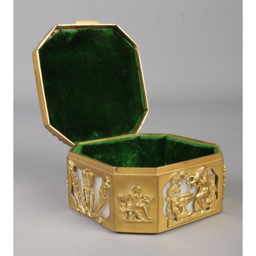 22 - A French gilt metal and mother of pearl box of cantered square form. Having classical scenes and cen... 