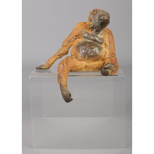 27 - John O'Connor (1967-) a small cold painted bronze sculpture modelled as a seated orangutan. Approxim... 