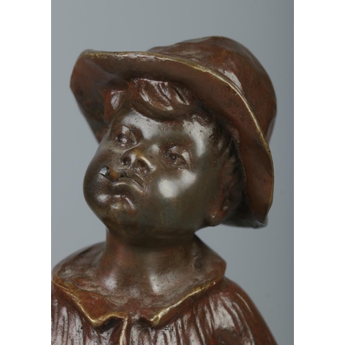 32 - A bronze sculpture of a young boy raised on a square slate plinth. Modelled smoking a cigar, stood w... 