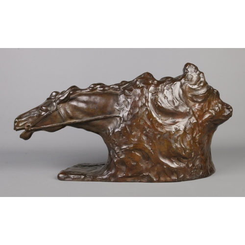 35 - A bronze sculpture modelled as two horses heads. Signed R De Wandeleir. Height 26cm, Length 50cm.