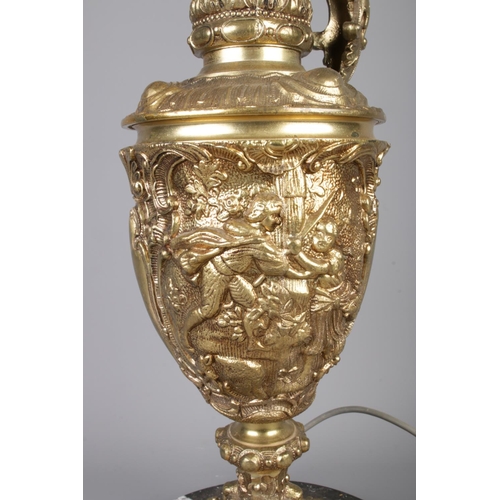 39 - A Renaissance style gilt metal ewer lamp raised on circular marble base. With figural Height 74cm.