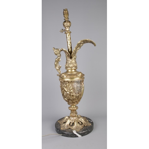 39 - A Renaissance style gilt metal ewer lamp raised on circular marble base. With figural Height 74cm.