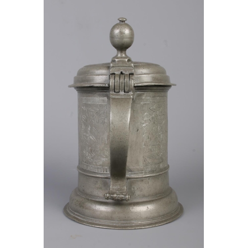 43 - A Bohemian pewter quart tankard. Having engraved decoration. Crowned initials AAS 1606 to top and be... 