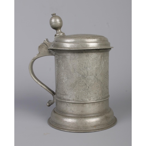 43 - A Bohemian pewter quart tankard. Having engraved decoration. Crowned initials AAS 1606 to top and be... 