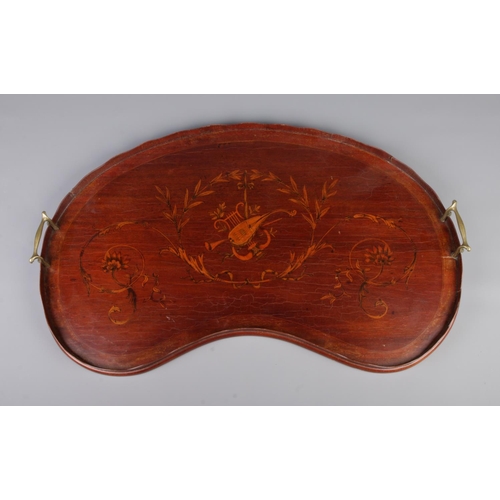 49 - A 19th century mahogany twin handled kidney shaped tray. Having marquetry inlaid decoration depictin... 