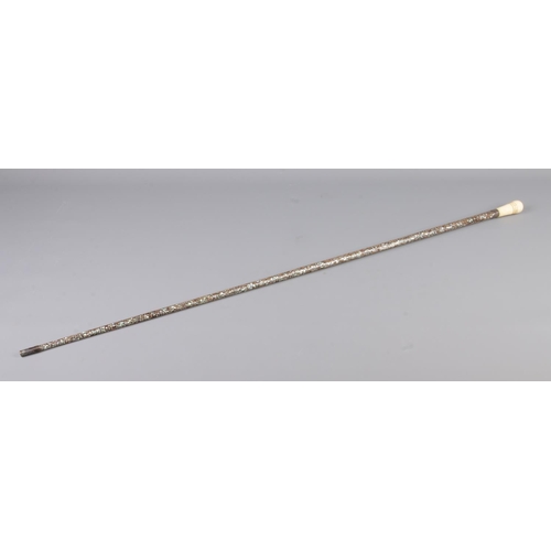 51 - A ladies abalone set walking cane with bone pommel and white metal mounts. Length 87cm.