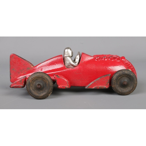 60 - A Hubley cast iron model racing car with driver. Length 17cm.