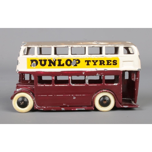 63 - A Dinky Meccano diecast model double decker bus, 29C, advertising Dunlop Tyres. Length 10cm.