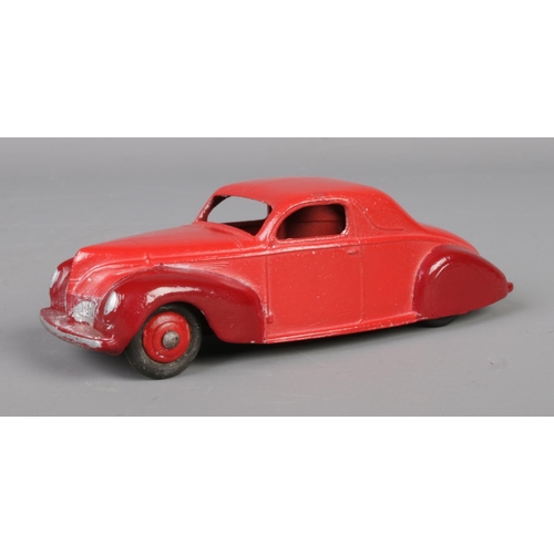 64 - A vintage Dinky Toys Lincoln Zephyr 39C. Red with maroon wings. Length 10.5cm.