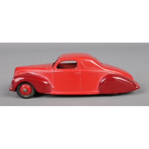 64 - A vintage Dinky Toys Lincoln Zephyr 39C. Red with maroon wings. Length 10.5cm.