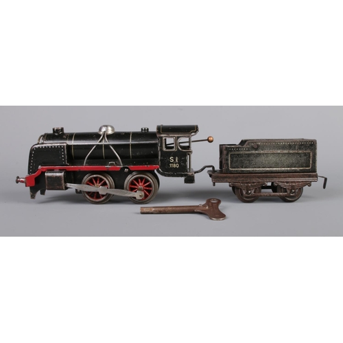 67 - Three vintage German clockwork tinplate O gauge locomotives with tender. Includes Marklin R880 with ... 