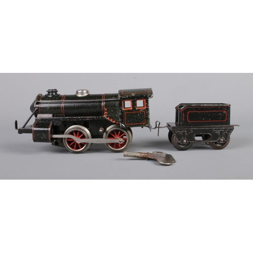 67 - Three vintage German clockwork tinplate O gauge locomotives with tender. Includes Marklin R880 with ... 