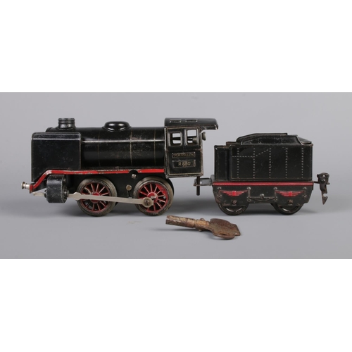 67 - Three vintage German clockwork tinplate O gauge locomotives with tender. Includes Marklin R880 with ... 