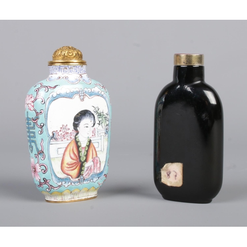 7 - A Chinese Canton enamel snuff bottle along with another with seal to base. Height 7.5cm.