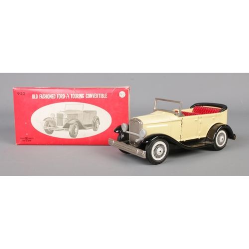 71 - A vintage Paya tin plate mechanical taxi along with a boxed Japanese tin plate Ford-A Touring Conver... 