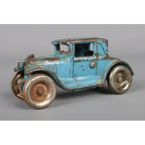 72 - A 1920s/1930s Arcade cast iron model car, numbered 113. Length 10.5cm.