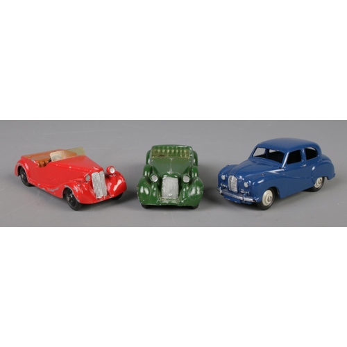 79 - Three Dinky Meccano diecast model cars; deep blue Austin Somerset 40J, green Lagonda 38C and red Sun... 