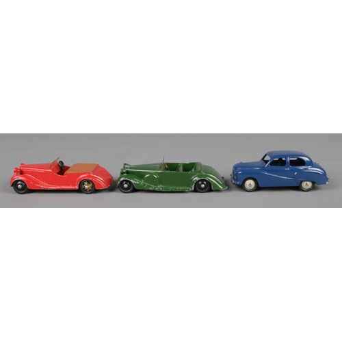 79 - Three Dinky Meccano diecast model cars; deep blue Austin Somerset 40J, green Lagonda 38C and red Sun... 