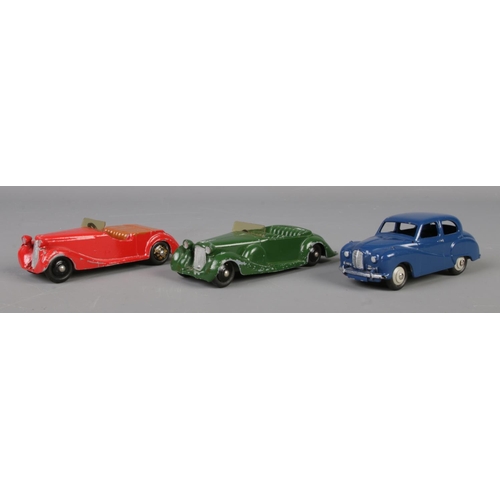 79 - Three Dinky Meccano diecast model cars; deep blue Austin Somerset 40J, green Lagonda 38C and red Sun... 