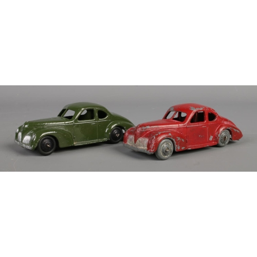 80 - Two Dinky Meccano diecast model cars, Studebaker 39F, green and red paint. Length 10.5cm.