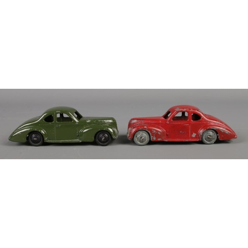 80 - Two Dinky Meccano diecast model cars, Studebaker 39F, green and red paint. Length 10.5cm.