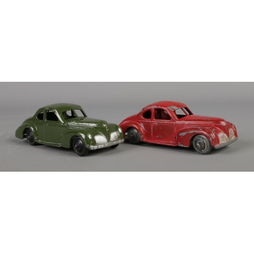 80 - Two Dinky Meccano diecast model cars, Studebaker 39F, green and red paint. Length 10.5cm.