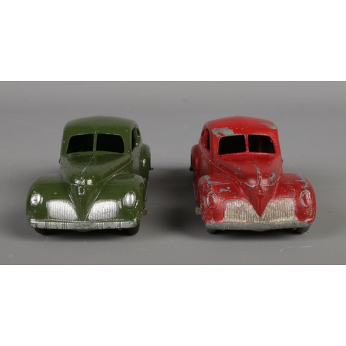 80 - Two Dinky Meccano diecast model cars, Studebaker 39F, green and red paint. Length 10.5cm.