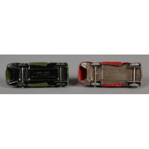 80 - Two Dinky Meccano diecast model cars, Studebaker 39F, green and red paint. Length 10.5cm.