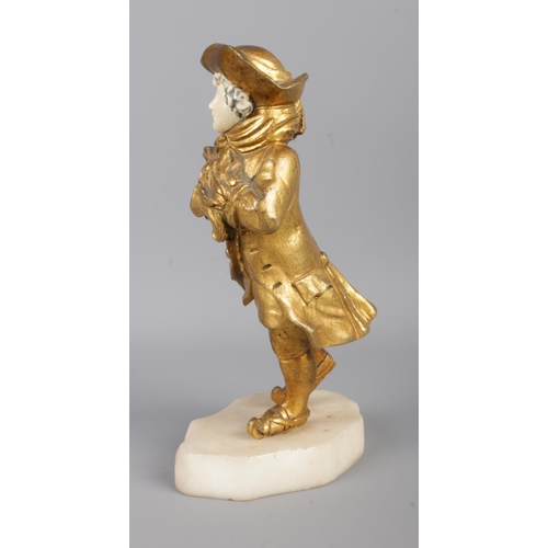 29 - An early 20th century French gilt bronze and ivory (chryselephantine) figure modelled as a skating c... 