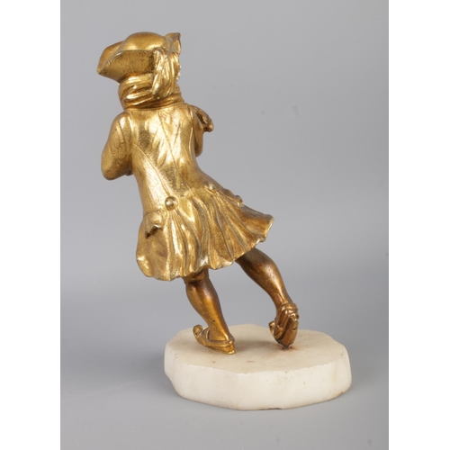 29 - An early 20th century French gilt bronze and ivory (chryselephantine) figure modelled as a skating c... 