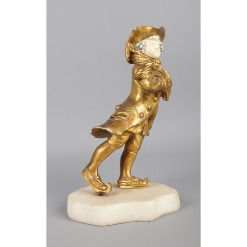 29 - An early 20th century French gilt bronze and ivory (chryselephantine) figure modelled as a skating c... 