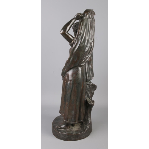 34 - Fernand Lorrain (19th century), a bronze figure group modelled as a couple sheltering from the rain.... 