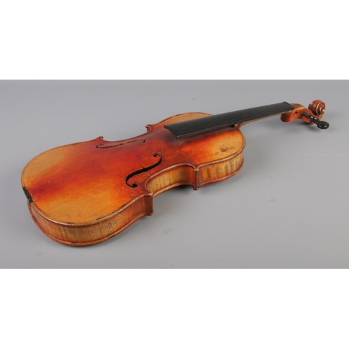 50 - A 19th century violin. Having 12inch two piece back and bearing spurious label 'Antonius Stradivariu... 