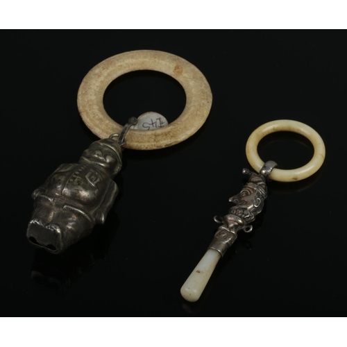 473 - Two antique baby teething rings, comprising a sterling silver jester with a mother-of-pearl handle (... 